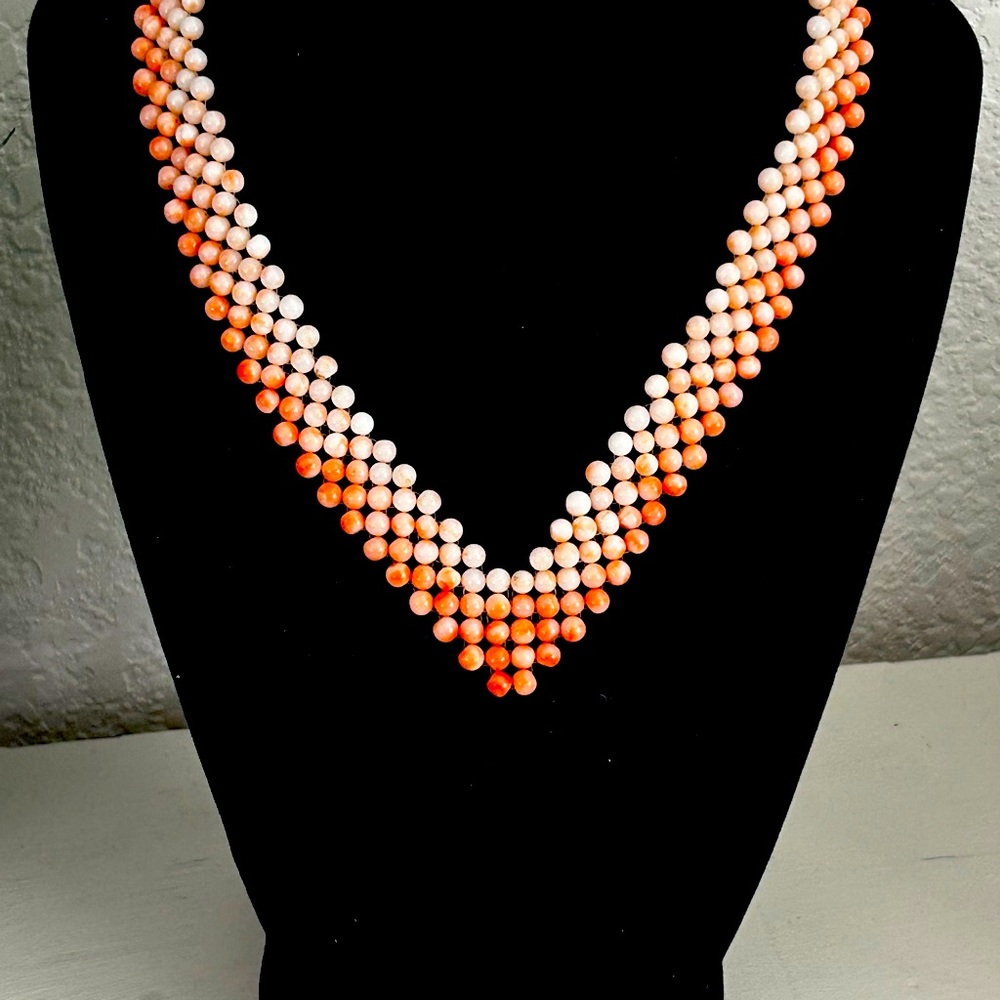 An Art Deco coral necklace, woven angel skin coral, with gilded silver clasp.